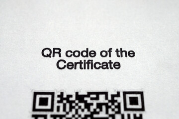Inscription "QR code certificate " in English on a paper form issued in Russia those who are vaccinated against coronavirus (fragment)