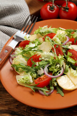 Delicious turnip salad served on wooden table, closeup
