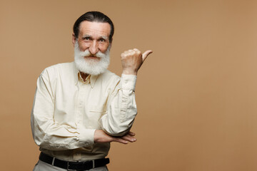European senior man with beard pointing fingers at opposite sides