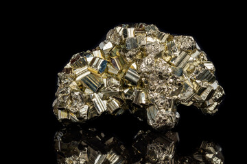 Macro mineral stone Pyrite on a black background
