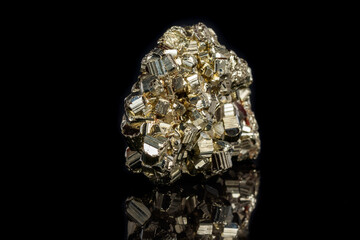 Macro mineral stone Pyrite on a black background