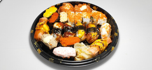 Closeup of sushi set with salmon, crab roe, crab sticks, cheese, mango, top view © Wheat field