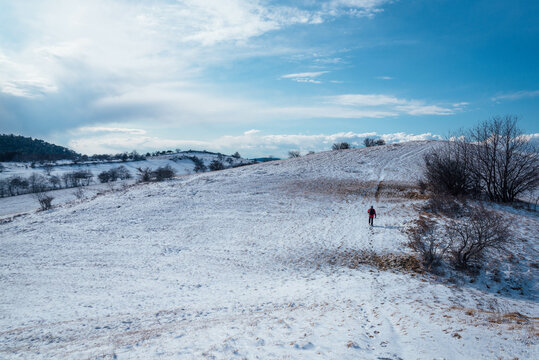 Man walking on the sonw hill