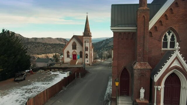 aerial: Historical St. Paul the Prospector Episcopal Church in the mining town of Virginia City, Nevada, USA