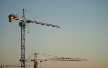 Construction cranes on a newly built housing estate