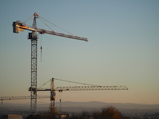 Construction cranes on a newly built housing estate
