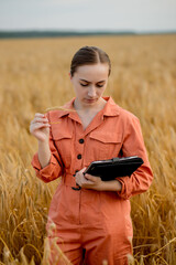 Agronomist holding test tube with barley grains in field, closeup. Cereal farming, oncept of wheat testing