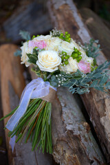 wedding bouquet of roses on wooden background