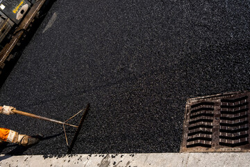 Paving a road with porous asphalt for traffic noise reduction in Geneva, switzerland