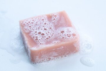 Homemade soap concept closeup, organic handmade with oils, herbal, and lavender ingredient, foamy...