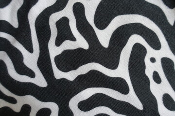 View of black and white cotton jersey fabric from above