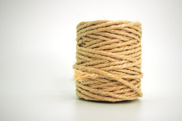 Jute rope in a skein on a white background. Close-up