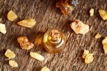 Obraz na płótnie Canvas A bottle of aromatherapy essential oil with frankincense resin