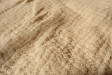 Close shot of beige muslin cotton fabric - obrazy, fototapety, plakaty