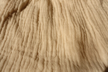 Close view of beige muslin cotton fabric