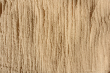 Thin beige muslin cotton fabric from above