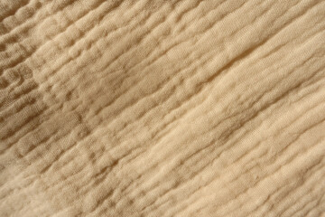 View of beige muslin cotton fabric from above