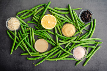Fototapeta na wymiar Dijon Tahini Green Beans Ingredients: Raw string beans, dijon mustard, and other ingredients