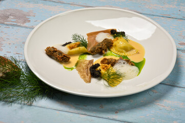 Fine dining appetizer Ravioli with seafood