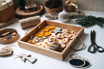 Eco friendly zero waste dried orange slices and DIY tools and stuff on the table. Handmade dried...
