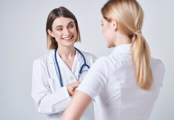 Fototapeta premium female doctor patient examination health care Studio hospital