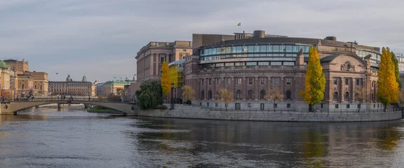 Foto op Plexiglas View of the Swedish Parliament House and the bridge Riksbron at the Opera and the house of The Ministry for Foreign Affairs an autumn day I Stockholm © Hans Baath