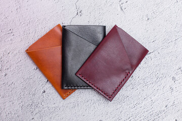 There are many different colored card holders. Unisex card holder made of genuine soft leather. Accessories made of leather made by hands