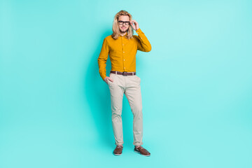 Full size photo of young handsome man happy positive smile confident eyeglasses isolated over turquoise color background