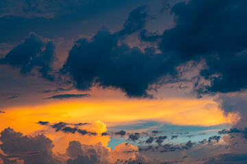 Purple and yellow clouds in a blue sky in  a sunset in a brazilian city