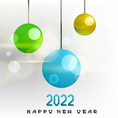 White glowing background with decoration balls and bokeh lights, new year's based