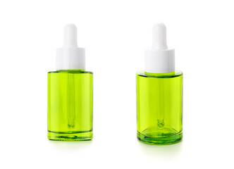 Green glass dropper serum bottle isolated on white background with clipping path