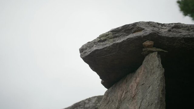 Close Up Of Menhir Stone Against Overcast Sky. Slide Shot, 4K