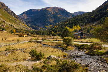 Panoramic view of the Incles valley in the middle of autumn where the pastures, forests and...
