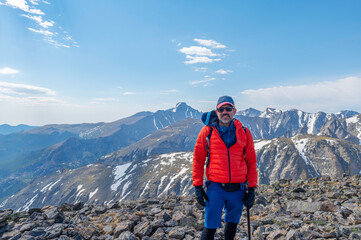 Hiker on the summit of Hallett Peak in Rocky Mountain National Park, Colorado, USA