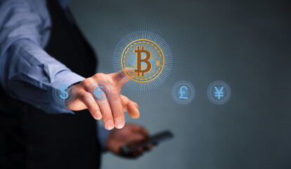 man holding phone with virtual bitcoin