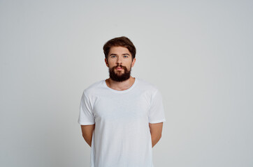 cute bearded man in white t-shirt fashion studio light background