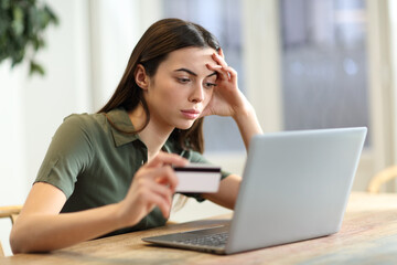 Fototapeta na wymiar Worried woman having problem buying online