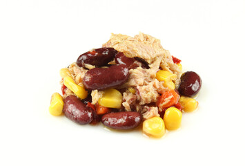 Pile of mexican tuna salad isolated on white background. Fish,corn,beans, chilli paprika etc.