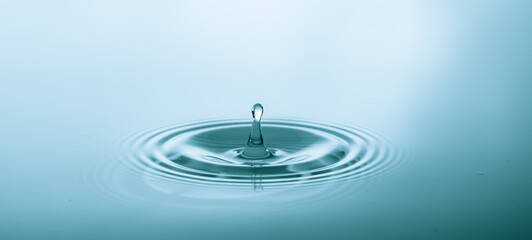 Splash of water droplets on a smooth water surface