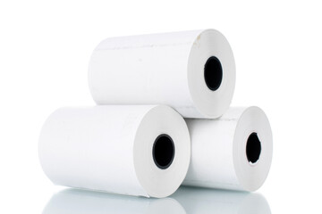 Three rolls of paper cash register tape, close-up isolated on white.