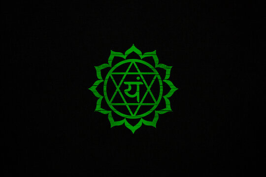 Anahata chakra, sacred symbol on a black canvas