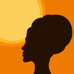 The silhouette of a dark-skinned African girl against the background of the circle of the sun.