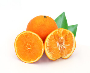 halved orange and green leaves isolated on white background