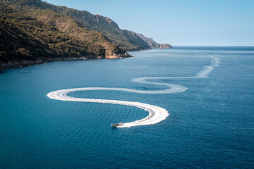 Pleasure boat snakes towards Porto in Corsica