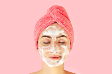 Woman facewash clean skin with exfoliation foam