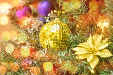 Fototapeta na wymiar Christmas balls decorate Christmas tree with balls and garland lights with copy space. Preparation to the New Year. 