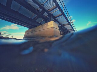 slipway bridge going into the sea from underneath