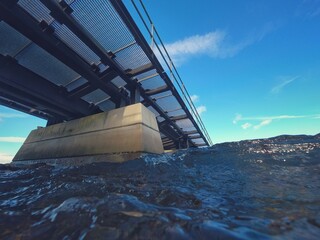 slipway bridge going into the sea from underneath