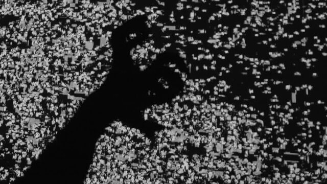 Night terror. Old horror movie. Social media anxiety. Haunted screen. Spooky monster hands silhouette scratching frightening on analog VHS glitch black white flicker noise TV background.