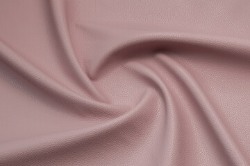 pink artificial leather with waves and folds on PVC base